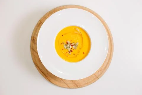 A plate of pumpkin soup Stock Photos