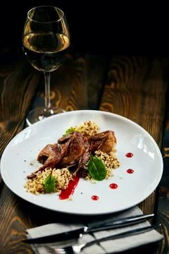 A plate of quinoa quail on a table Foto stock