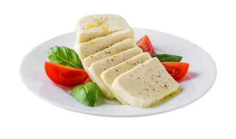 Plate with rectangular slices of mozzarella, basil and  tomato isolated on white Stock Photos
