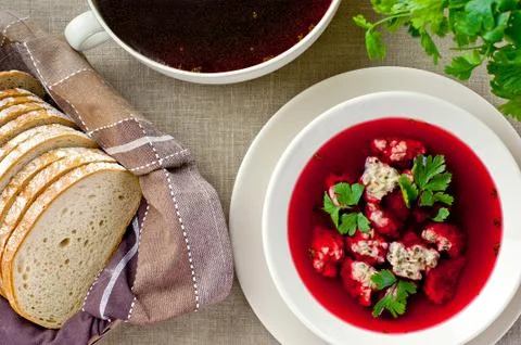 Plate of red borsch and bread - top view Stock Photos