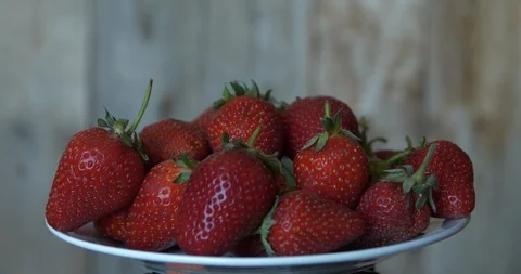 A plate of red strawberries Stock Footage 90858907
