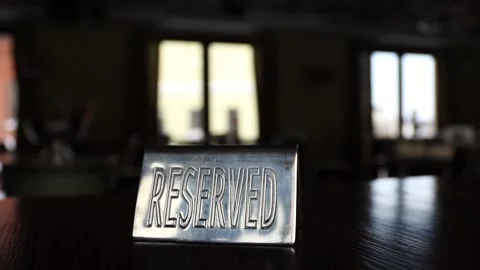 Plate reserved on a dark table in a cafe opposite the windows Video stock 154437238