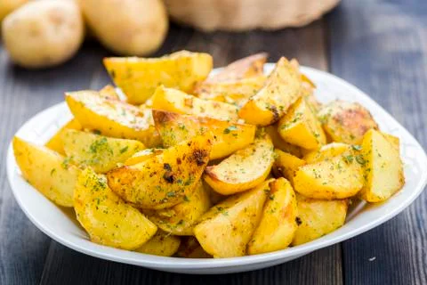 Plate with roasted potatoes Stock Photos