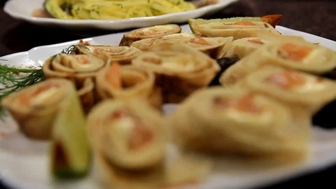 On a plate rolls with red fish Stock Footage 114292706