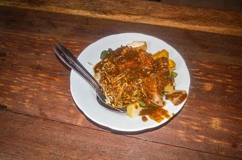 A plate of Rujak Cingur serving on a dining table is a typical East Javanes.. Stock Photos