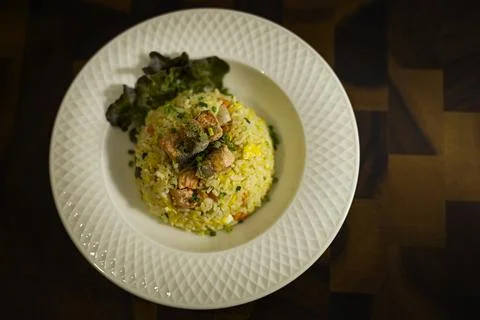 Plate Of Salmon Fried Rice On Rustic Wooden Table Stock Photos