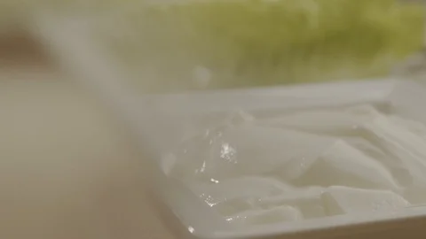 On plate with sauce throw sliver of spices. Slow motion video Stock Footage 113602457