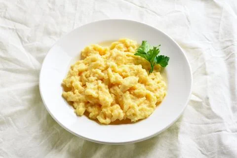 Plate with scrambled eggs Stock Photos