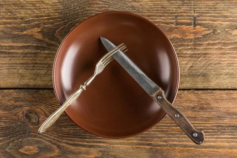 Plate setting on wooden table Stock Photos