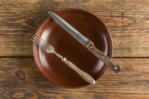 Plate setting on wooden table Stock Photos