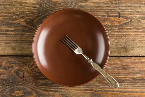 Plate setting on wooden table Stock Photos