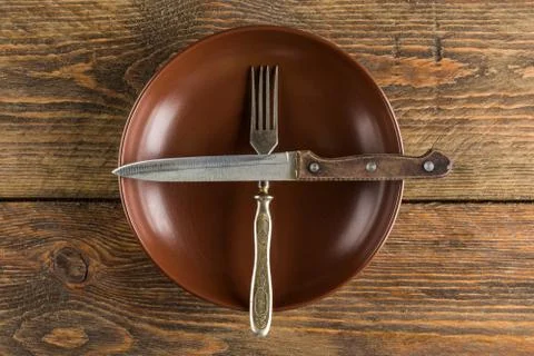 Plate setting on wooden table Stock Photos