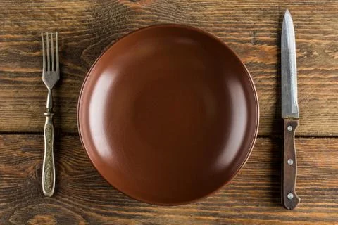 Plate setting on wooden table Stock Photos