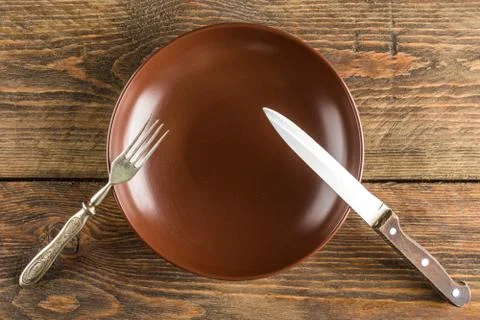 Plate setting on wooden table Stock Photos