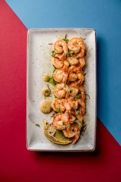 Plate with shrimp lemon microgreen cafe restaurant grilled grill top Stock Photos
