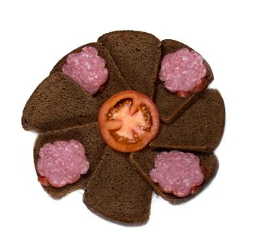 Plate of sliced black bread and sausage on white background Stock Photos