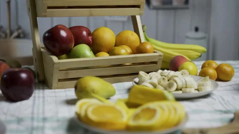 Plate of sliced oranges surrounded by other delicious fruit - tracking shot Stock Footage 341027332