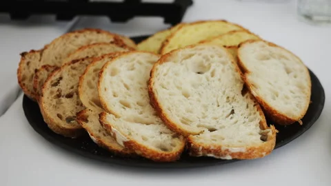A plate with slices of bread on a served table. Stock Footage 318002446