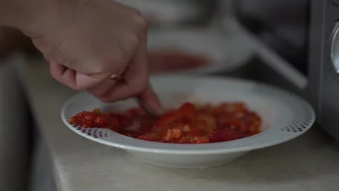 The plate slips out of my hands. Berry dessert on a plate. Strawberries with Stock Footage 292874480
