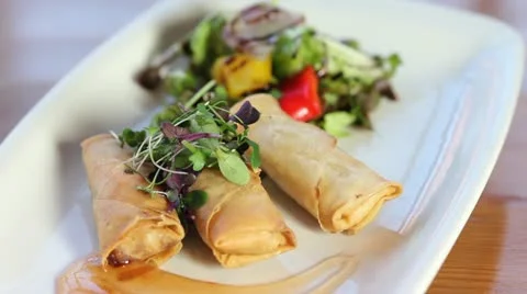 Plate of spring rolls Stock Footage 21033021