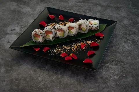 A plate of sushi with a leaf on it Stock Photos