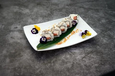 A plate of sushi with a leaf on it Stock Photos
