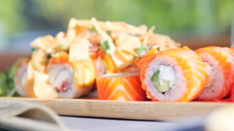 Plate of sushi rolls is set on table ready to deliver authentic taste of Japan Stock Footage 282717429