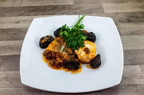 Plate of sweet and sour cod on white plate Stock Photos