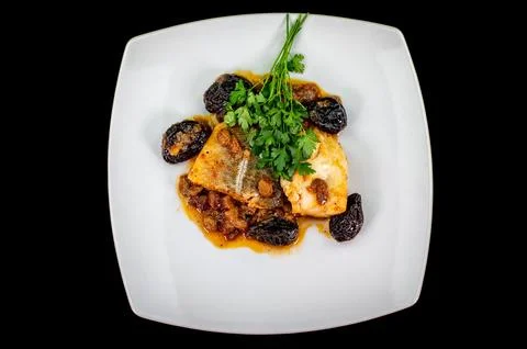 Plate of sweet and sour cod on white plate Stock Photos