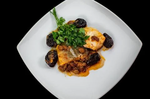 Plate of sweet and sour cod on white plate Stock Photos