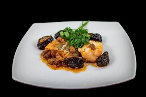 Plate of sweet and sour cod on white plate Stock Photos