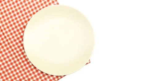 Plate on tablecloth on white background Stock Photos