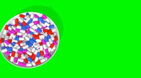 A plate of tablets on a green screen appears with the view from the top Stock Footage 60707464