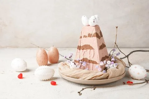 Plate with tasty curd Easter cake, eggs, candles, tree branches and gypsophil Stock Photos