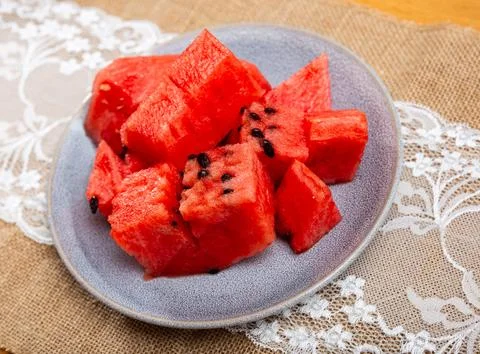 In plate there is small portion of watermelon pulp, useful cubes Stock Photos