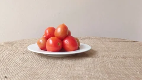 A plate of tomatoes on a table Stock Footage 151023618