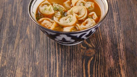 Plate with uzbek dumplings chuchvara in a restaurant Stock Footage