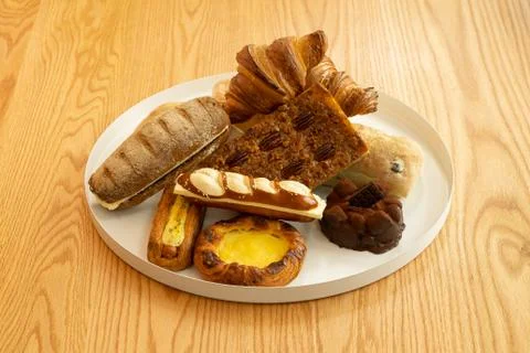 A plate of various kinds of bread	 Stock Photos