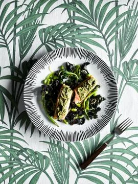 Plate of vegetable, on palm-leaf pattern background Stock Photos