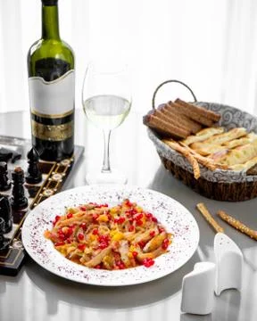 A plate of vegetable stew served with white wine and bread Stock Photos