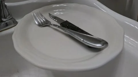 Plate vibrating on sink Stock Footage 232280811