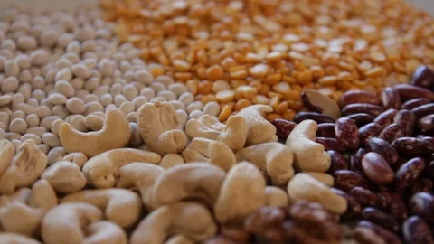 Plate on which dry red beans and yellow peas and various nuts.close-up.macro.the Stock Footage 121197217