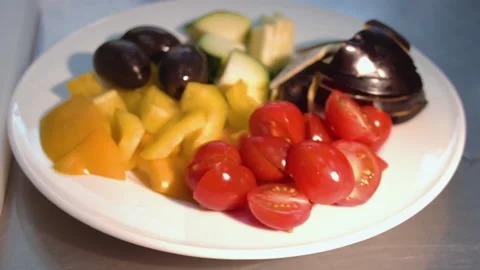 A plate on which there is a zucchini pepper onion garlic tomato Stock Footage 158020511