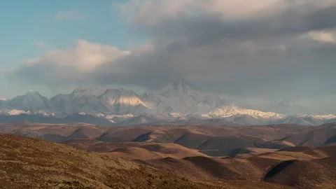 Plateau Snow Mountain Time-lapse with Rolling Clouds and Peak Scenery Stock Footage 326673207