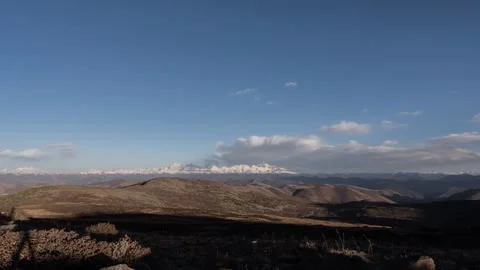 Plateau Snow Mountain Time-lapse with Rolling Clouds and Peak Scenery Stock Footage 326673413