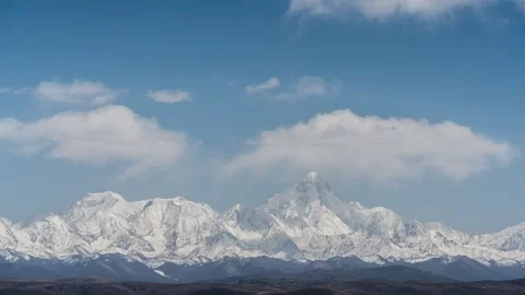 Plateau Snow Mountain Time-lapse with Rolling Clouds and Peak Scenery Stock Footage 326674908