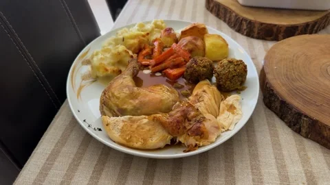 Plated Roast Chicken Sunday Dinner with Gravy Close-Up. Stock Footage 345996314