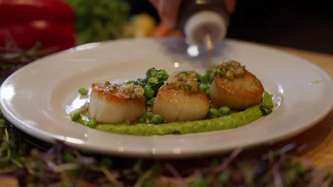Plated scollop dinner professional chef restaurant kitchen food meal dinner Stock Footage 246703266