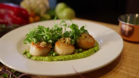 Plated scollop dinner professional chef restaurant kitchen food meal dinner Video stock 246703271