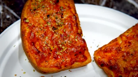 A Plateful of Delightful Garlic Breads, Each Bite a Symphony of Flavor in Delhi Stock Footage 257867727